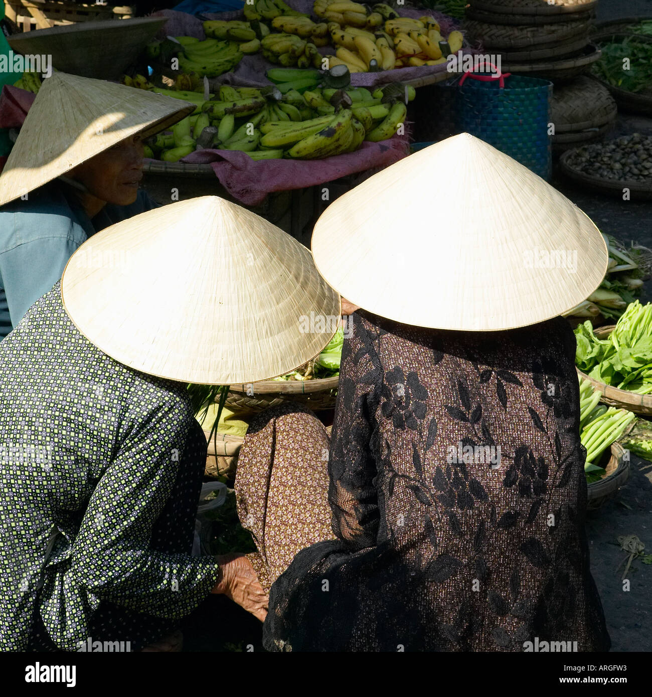 Women selling produce in market of Hoi An, Vietnam. Stock Photo