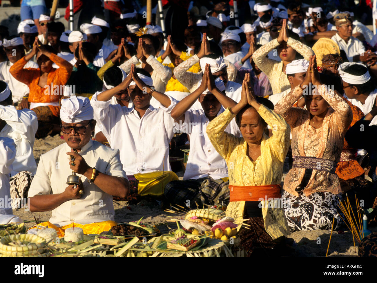 Kuta Beach, Ceremony Bali funereal cremation Balinese funeral procession, faith offering, Hindu universe, crowd, group, people, men, women, Indonesia, Stock Photo