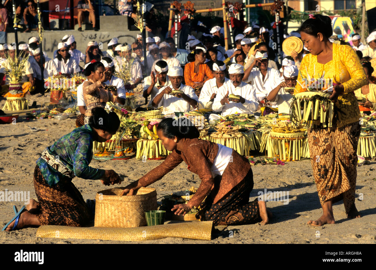 Kuta Beach, Ceremony Bali funereal cremation Balinese funeral procession, faith offering, Hindu universe, crowd, group, people, men, women, Indonesia, Stock Photo