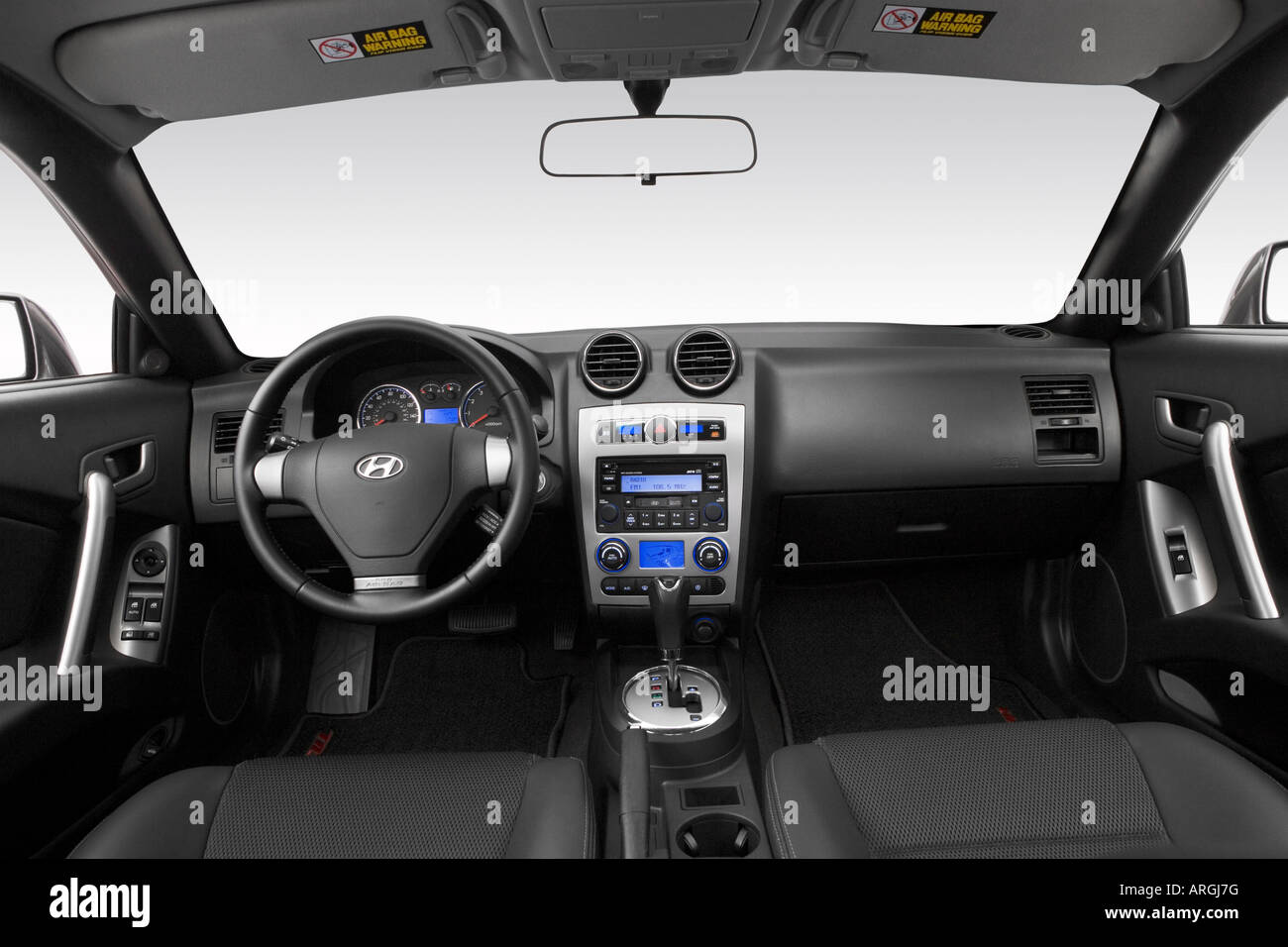 2007 Hyundai Tiburon GT in Gray - Dashboard, center console, gear shifter view Stock Photo