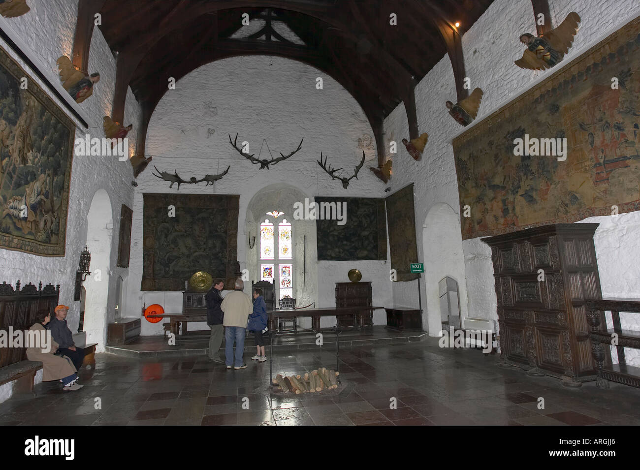 tourists in the great hall and banquet hall of bunratty castle Bunratty Folk Park County Clare Republic of Ireland Stock Photo