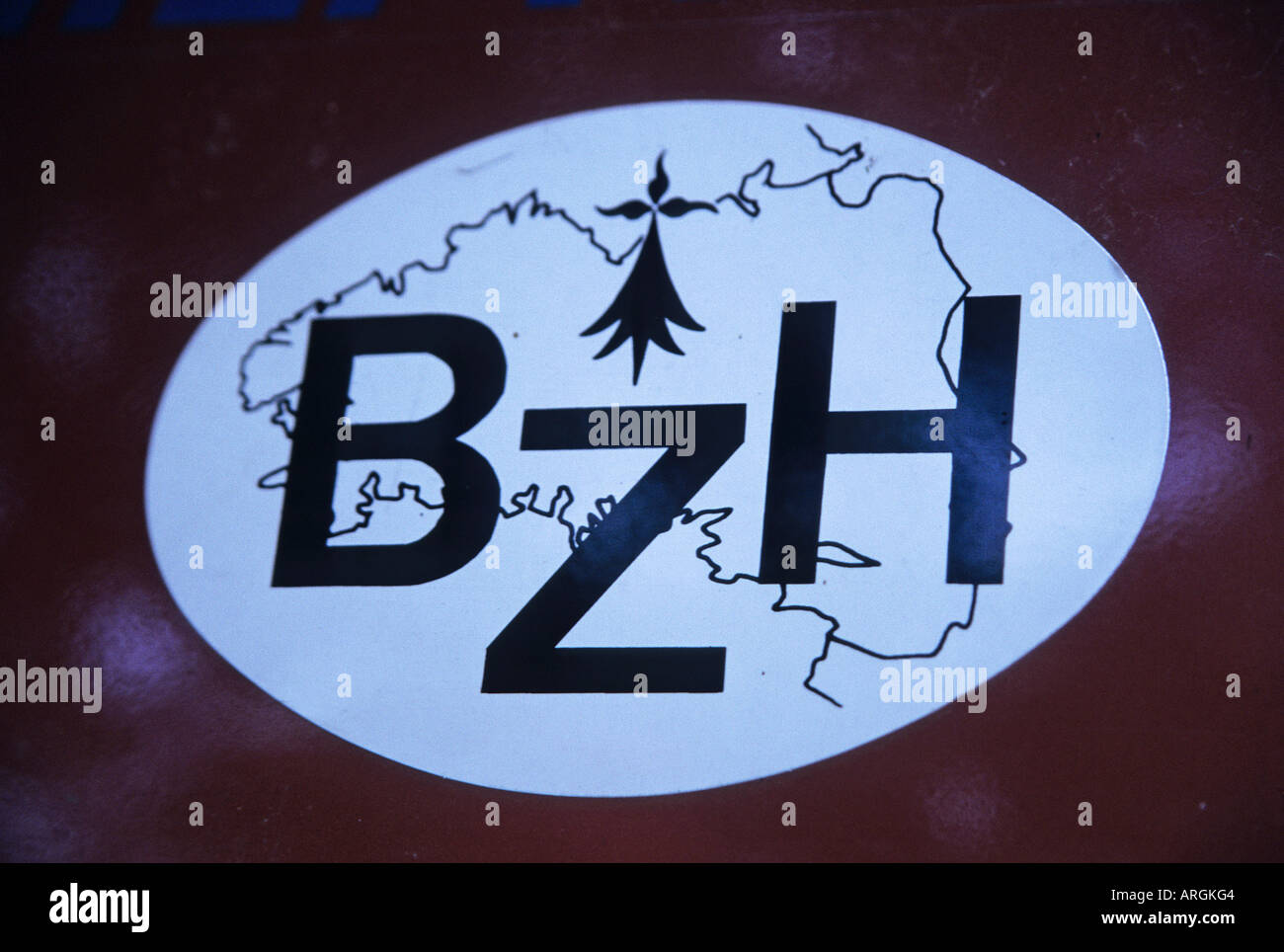 A sticker featuring the letters BZH superimposed on a line drawing of the map of Brittany Stock Photo