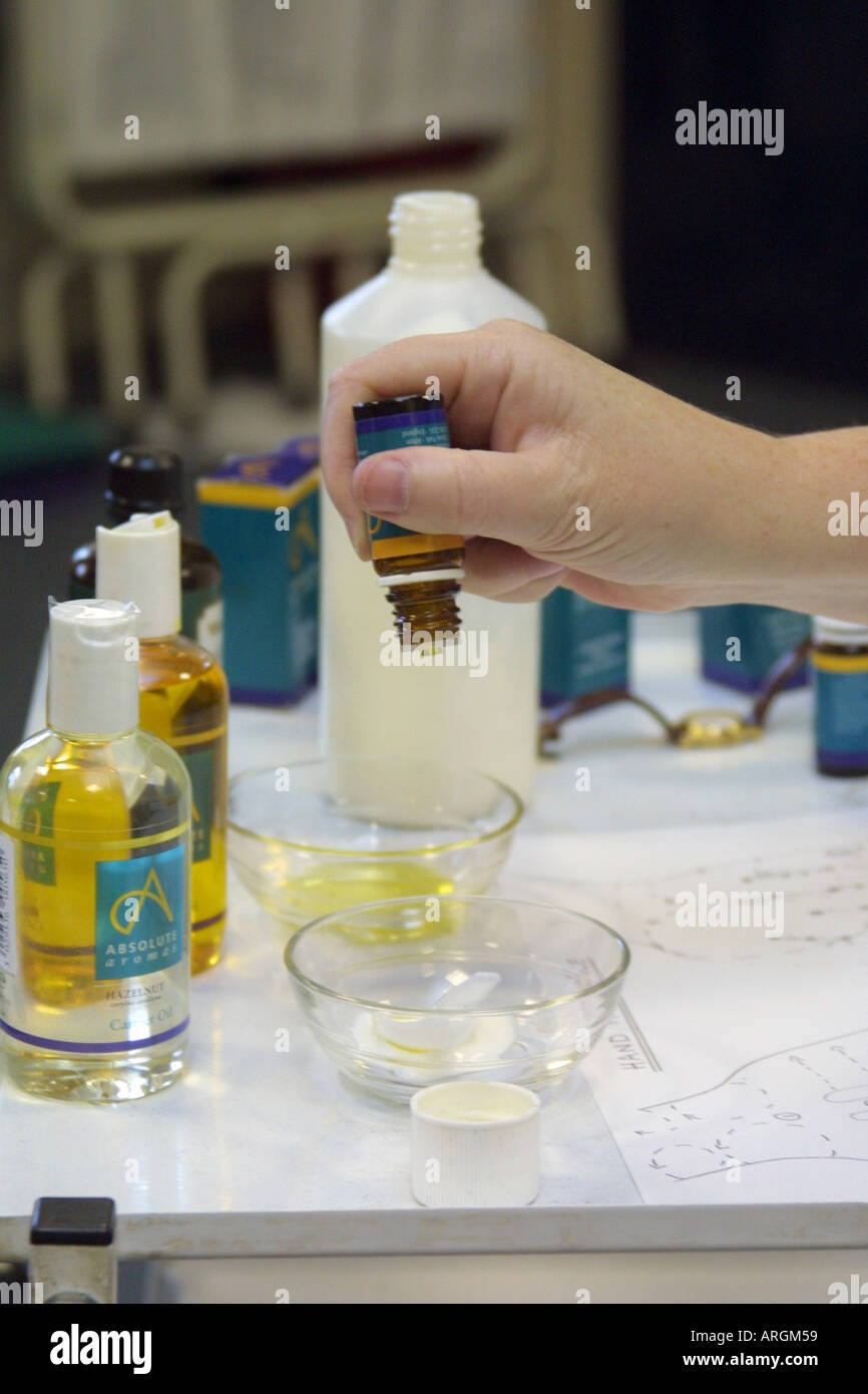 Aromatherapist preparing the essential oils for a massage. Stock Photo