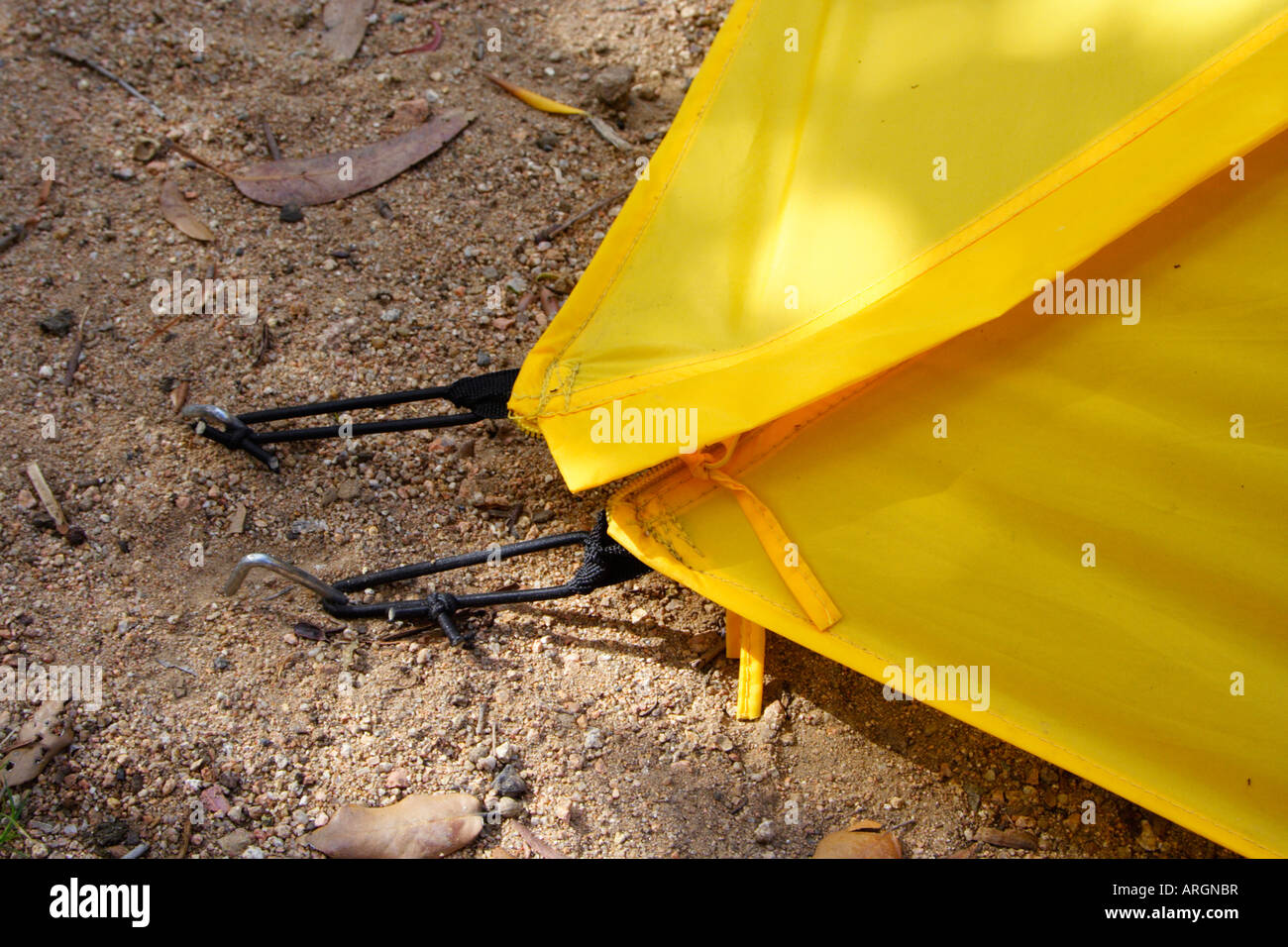 yellow tent and tent pegs Stock Photo Alamy