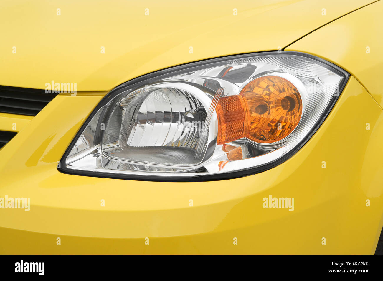 2007 Chevrolet Cobalt LS in Yellow - Headlight - Stock Image