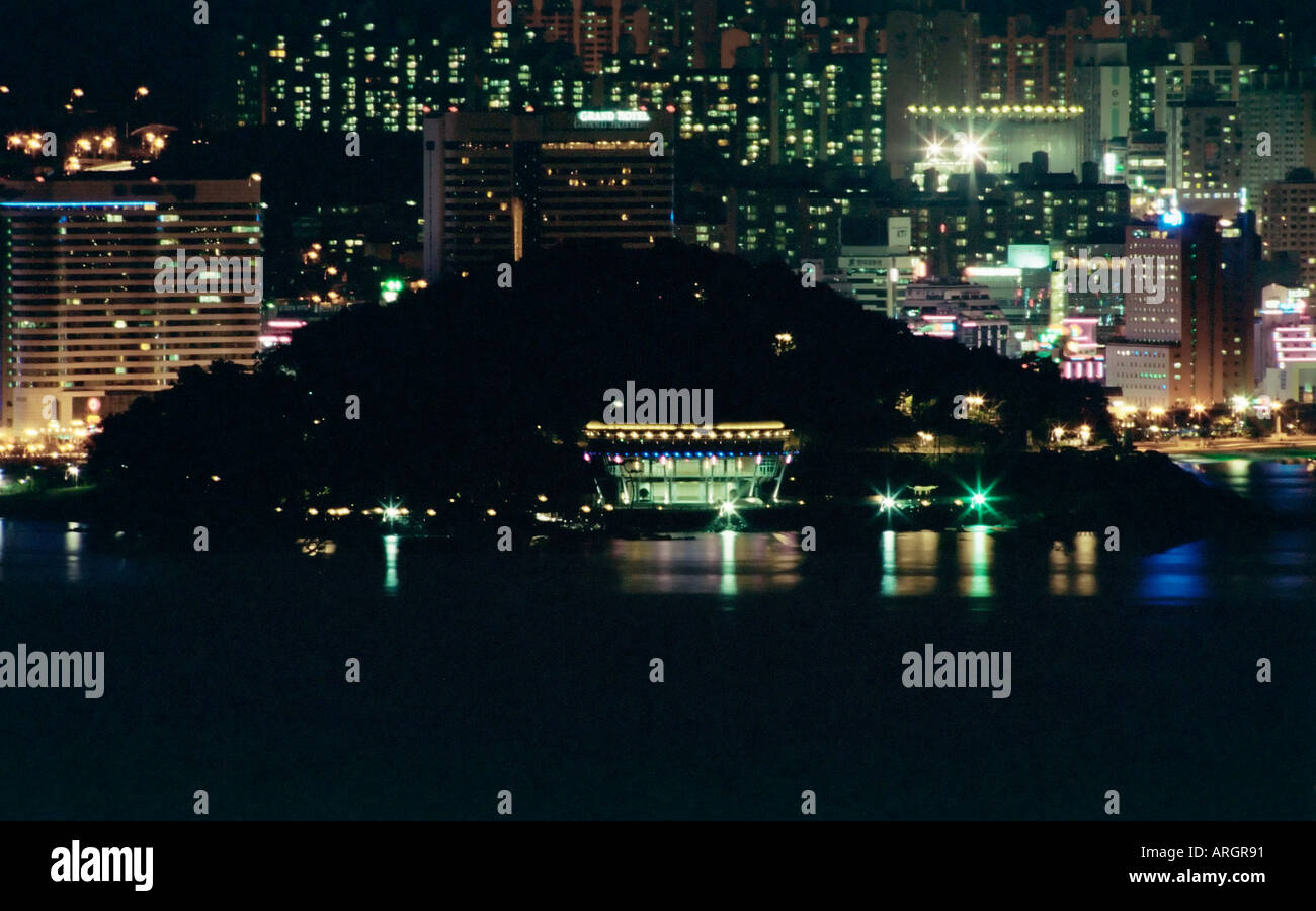 Nightview of Nurimaru APEC meeting venue in Busan South Korea with Haeundae Beach in the background Stock Photo
