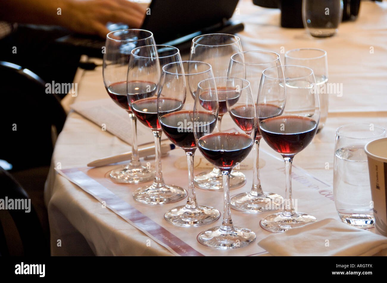 Group of people tasting red wine Stock Photo - Alamy