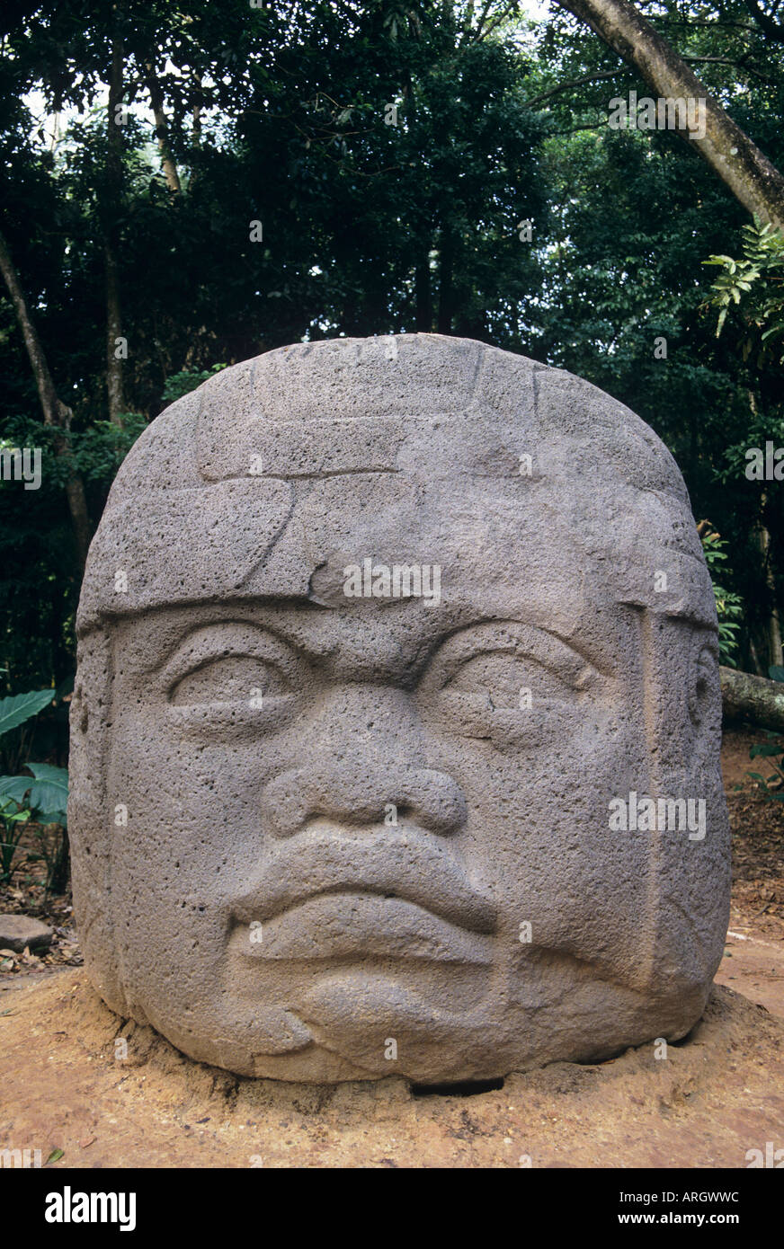 One of the three colossal sculpted Olmec stone heads displayed with other 900 300 BC remains from the site at La Venta in the Parque la Venta in Villahermosa capital city of Tabasco State Stock Photo