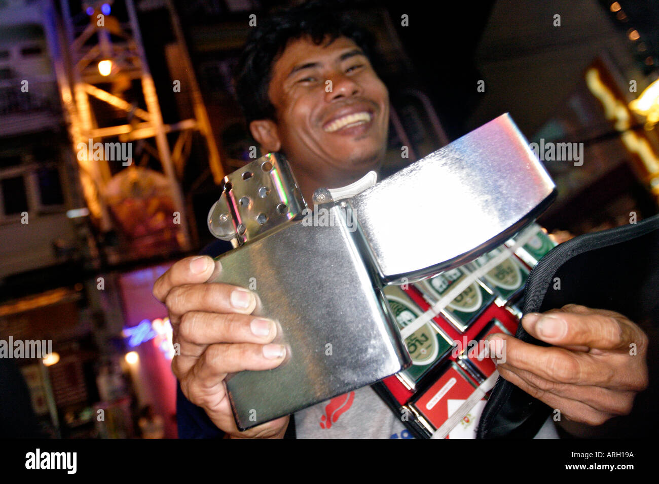 hawker sells big zippo on the Ko San Rd Bangkok Thailand Stock Alamy