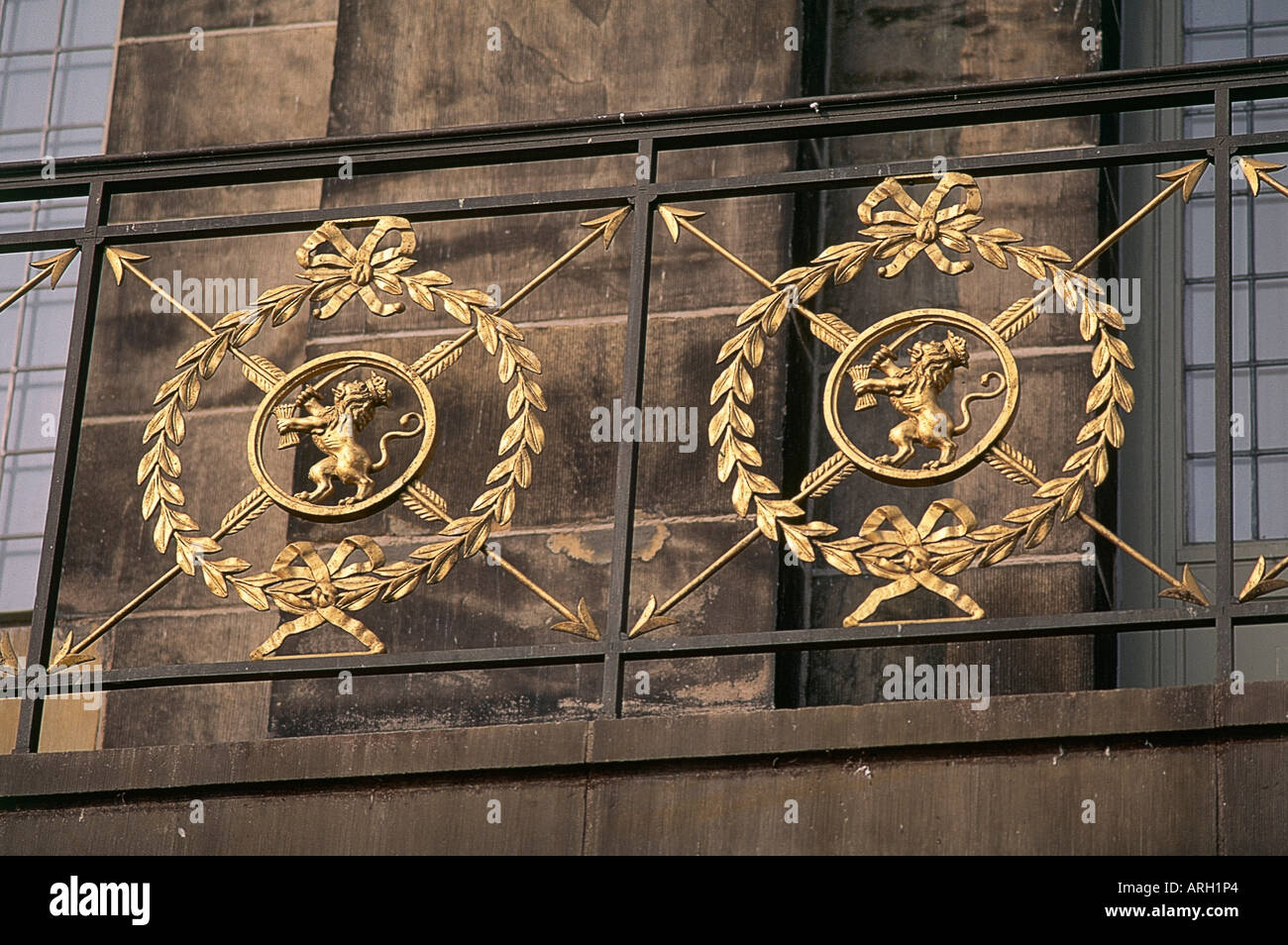 A detail of the gilded crests set in a wreath with an arrow design which adorn the railings of Amsterdam s 17th century Royal Palace Koninklijk Palace designed by Jacob van Campen and the City Hall until 1808 when Louis Bonaparte decided to take up residence Stock Photo