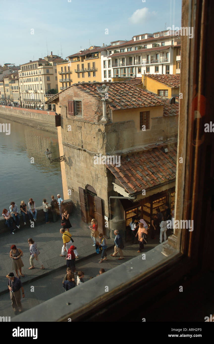 Looking out through one of the windows from the Vasari Corridor which links the Uffizi Gallery and Pitti Palace in Florence, Italy Stock Photo