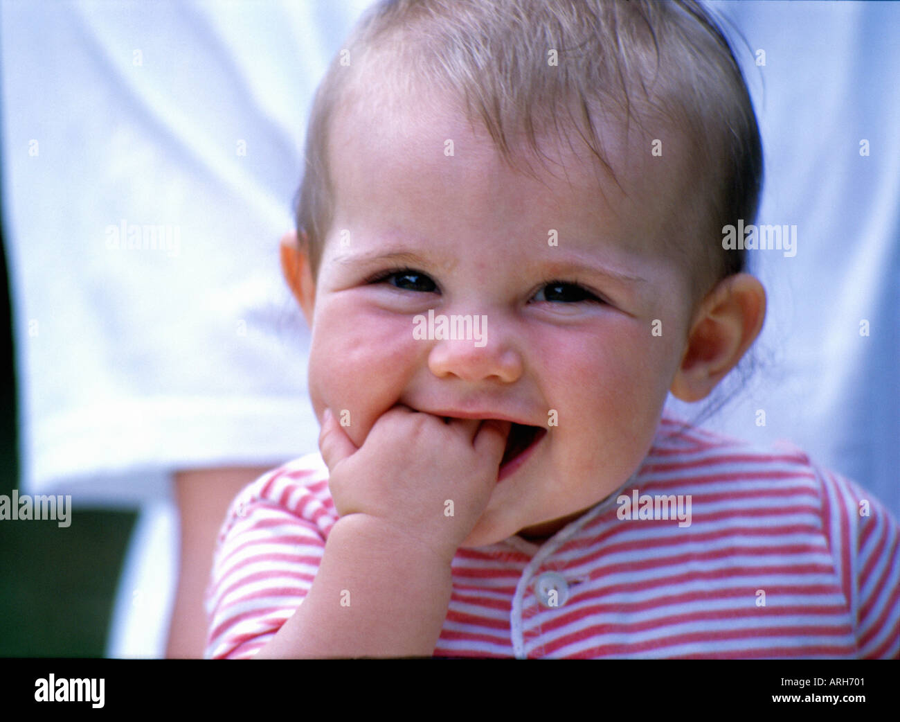Baby Chewing Hand Stock Photo Alamy