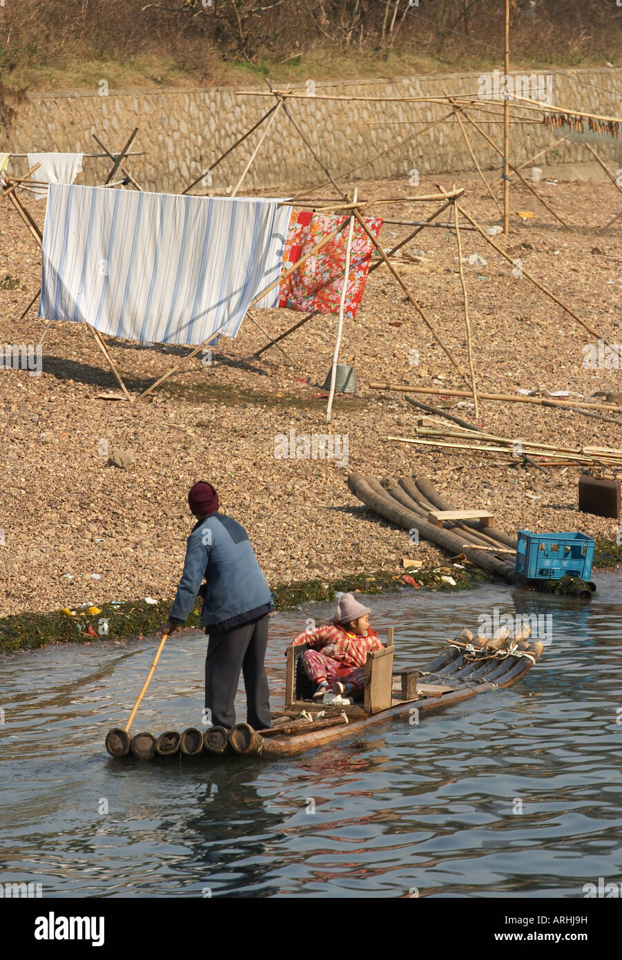 Chinese woman and child on bamboo raft, Yangshuo, China Stock Photo - Alamy
