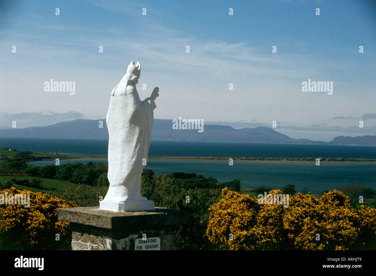 Statue of St Patrick at Croagh Patrick with views over Clew Bay Stock Photo