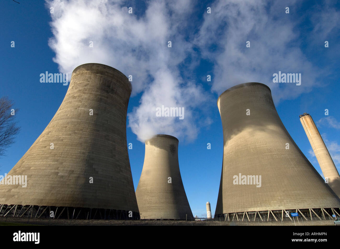 Clouds of steam rise from the cooling towers of the dual coal fired and