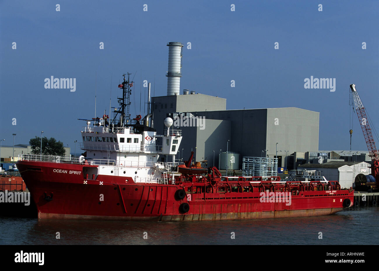 North Sea supply vessel 'Ocean Sprit' beside a gas-fired power station at the Port of Great Yarmouth, Norfolk, UK. Stock Photo