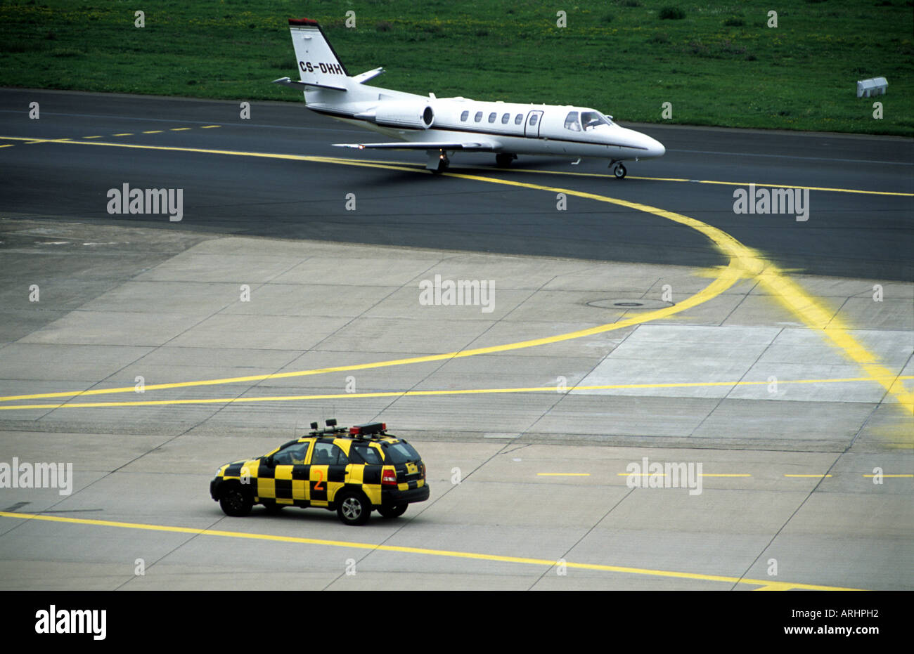 Private jet on the taxi-way at Dusseldorf International Airport, North Rhine-Westphalia, Germany. Stock Photo