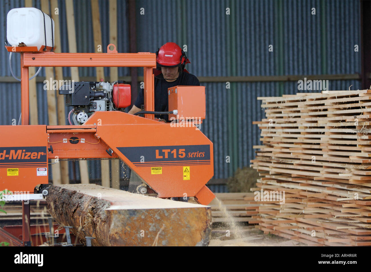 A log being milled using a Wood Mizer LT15 sawmill Stock Photo