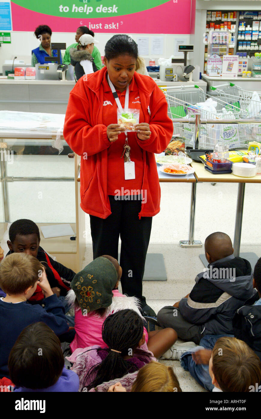 ASDA SUPERMARKET EVENT ORGANIZER INFORMING THE SCHOOL CHILDREN ABOUT ...