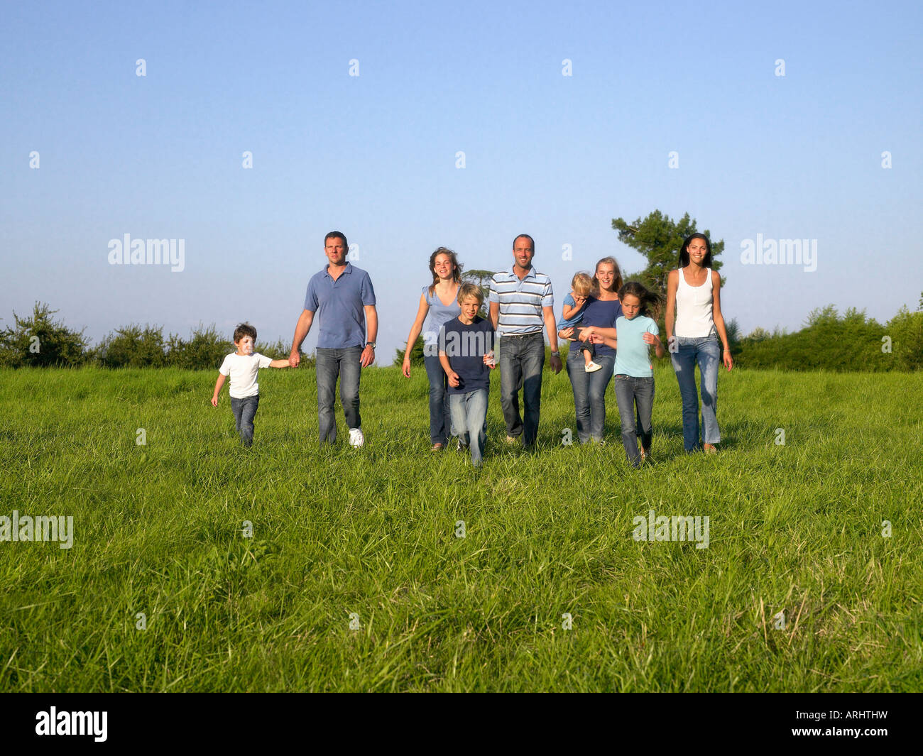 Group of people and children running Stock Photo