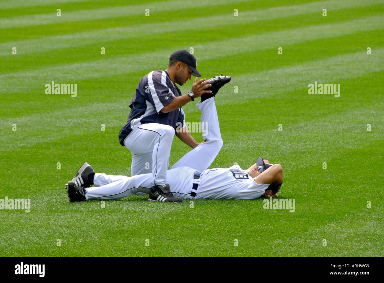 Warm up and stretching exercises prior to a Detroit Tiger Professional Baseball game at Comerica Park Detroit Michigan Stock Photo