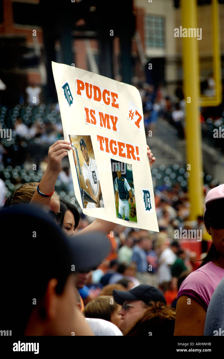 Fans hold signs in support of the Detroit Tiger Professional Major ...