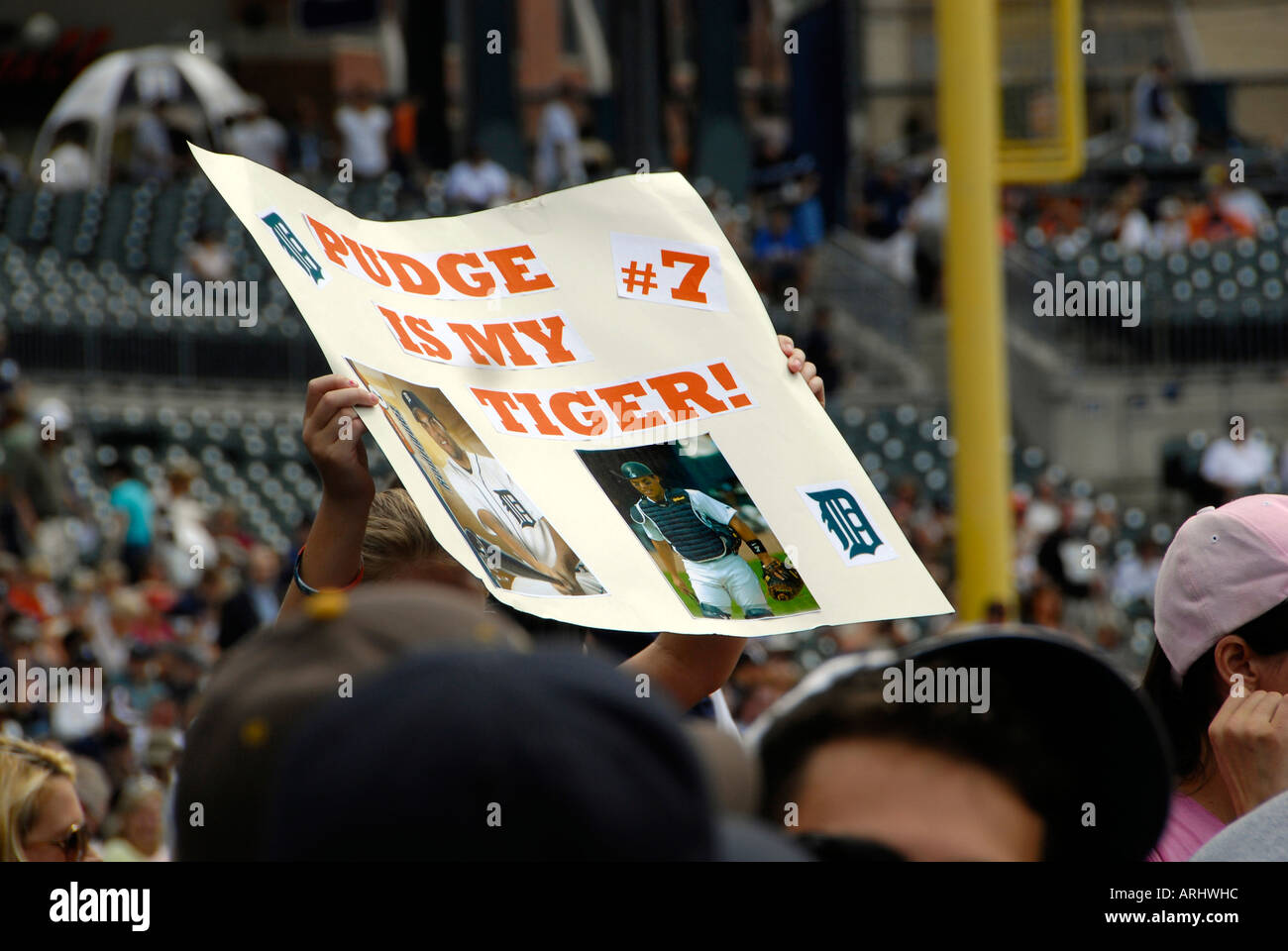 Fans hold signs in support of the Detroit Tiger Professional Major ...