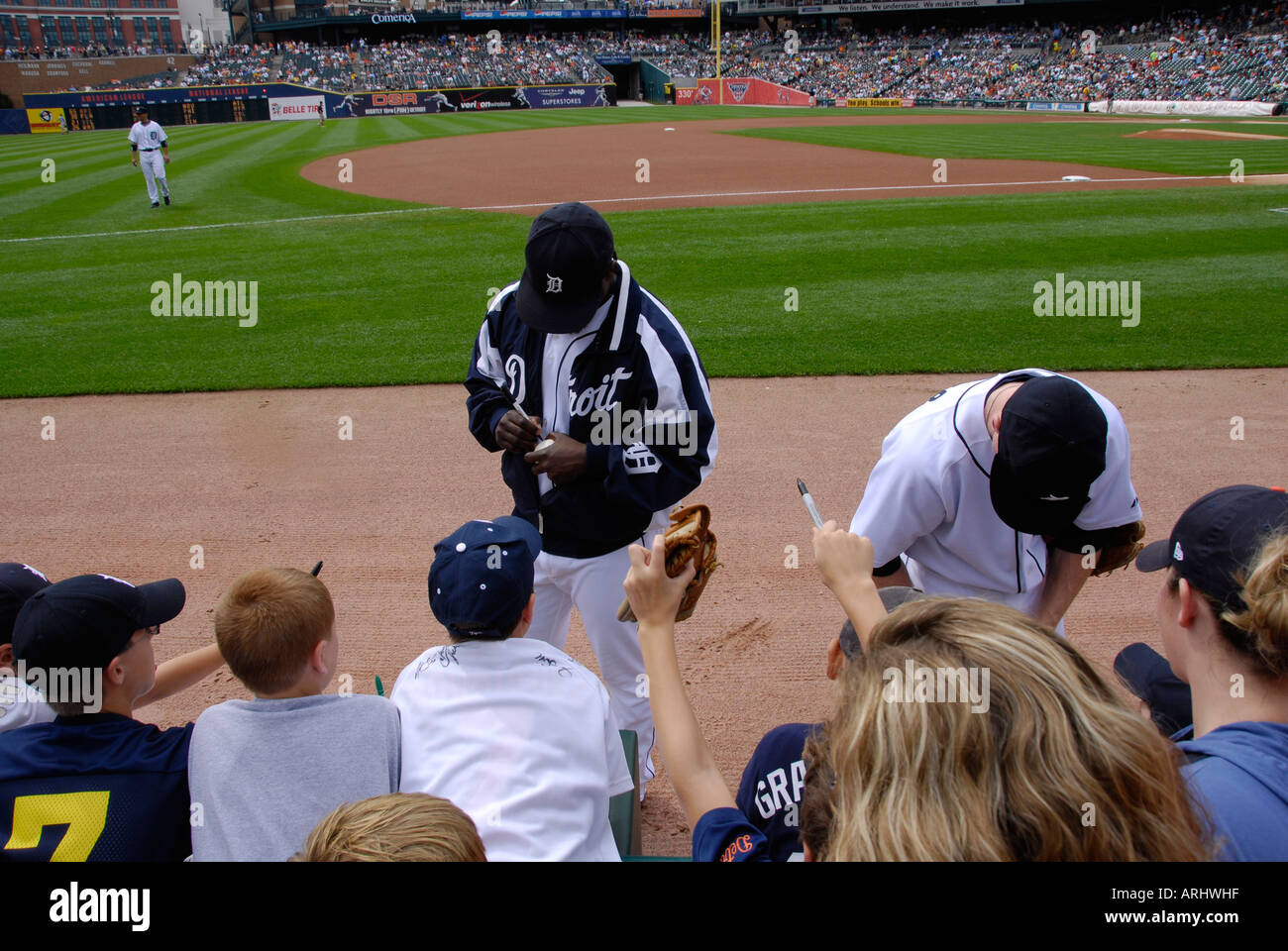 Players sign autographs prior to a Detroit Tiger Professional major league Baseball game at