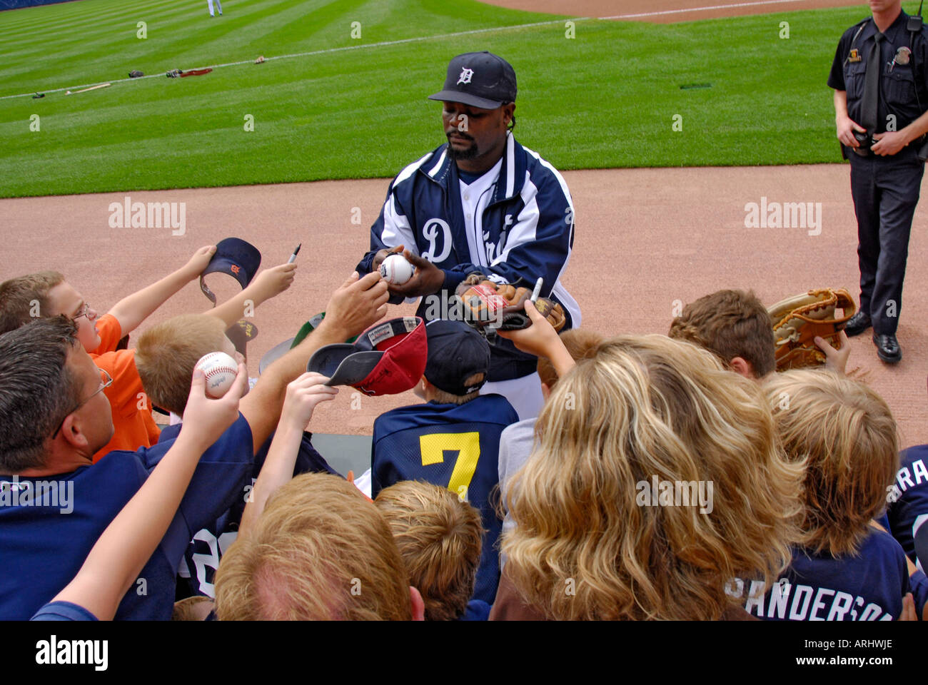 Players sign autographs prior to a Detroit Tiger Professional major league Baseball game at