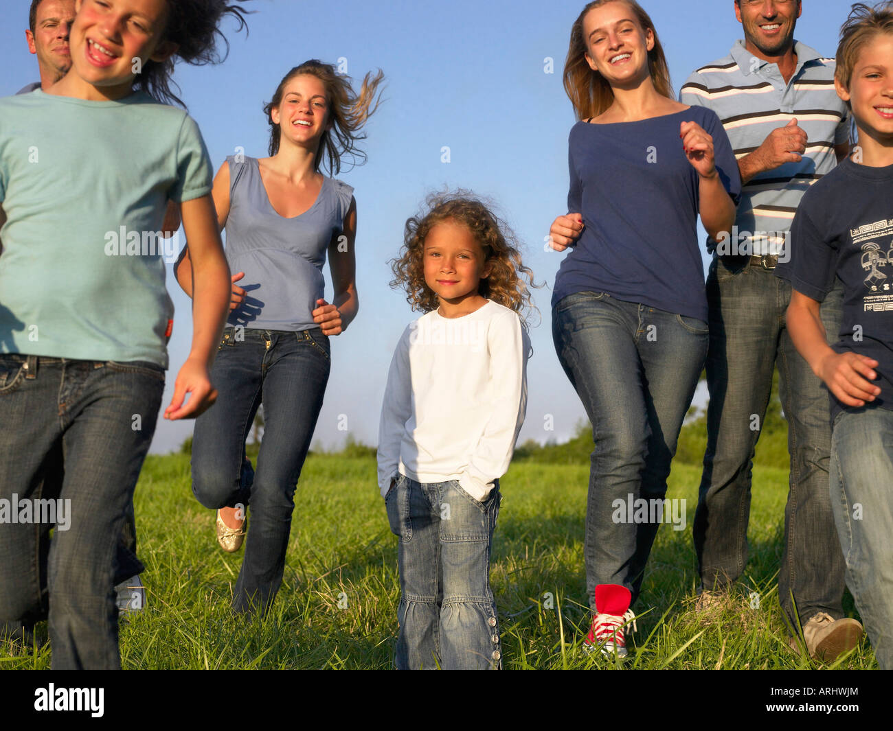 Group of people and children running Stock Photo