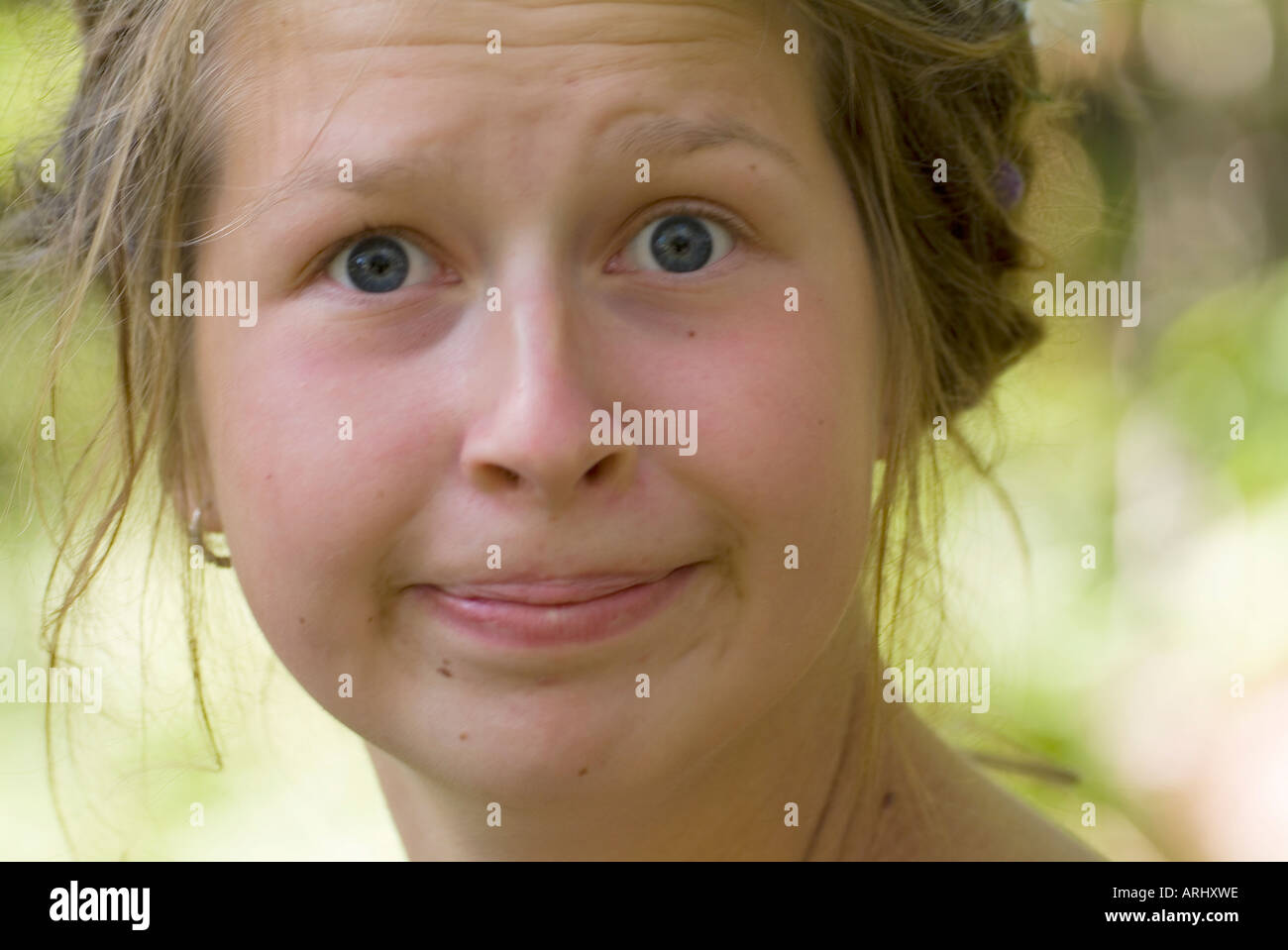 portrait of a young woman girl with helpless astonished suprised upset facial expression Stock Photo