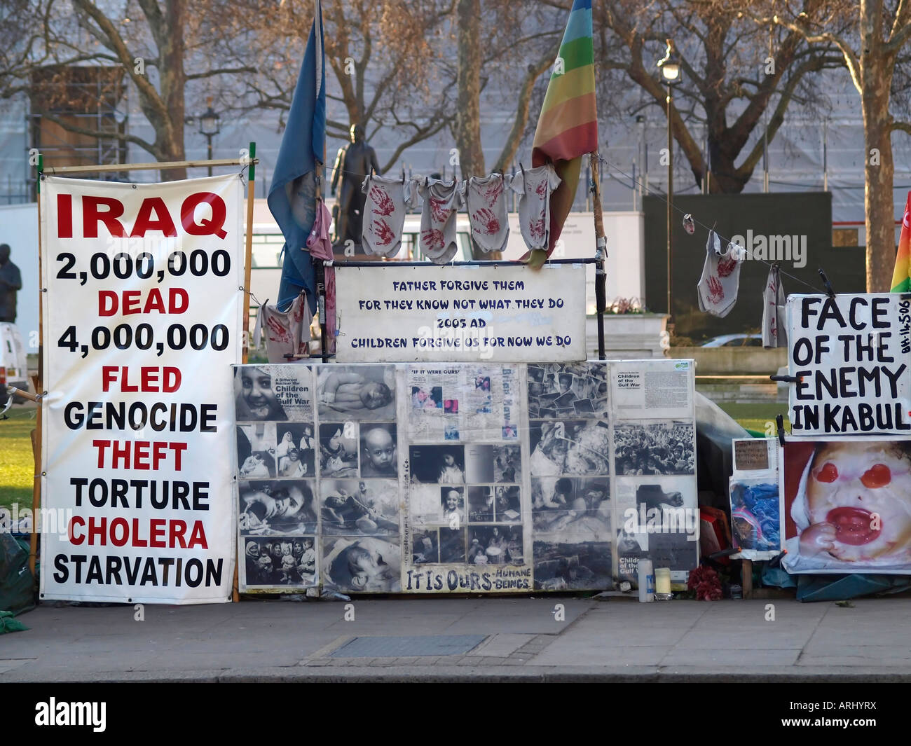 Placards at the Peace camp of Brian Haw the anti war protester in Parliament Square London England Stock Photo