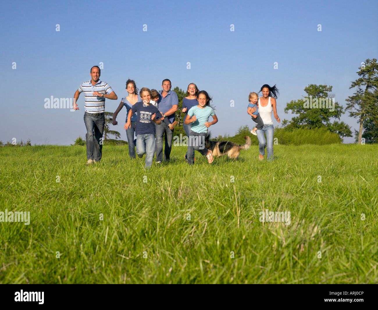 Group of people and children running Stock Photo