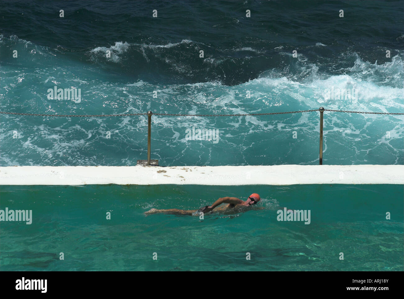A lone swimmer at the Bondi Icebergs pool, Bondi Beach, Sydney, New South Wales, Australia Stock Photo