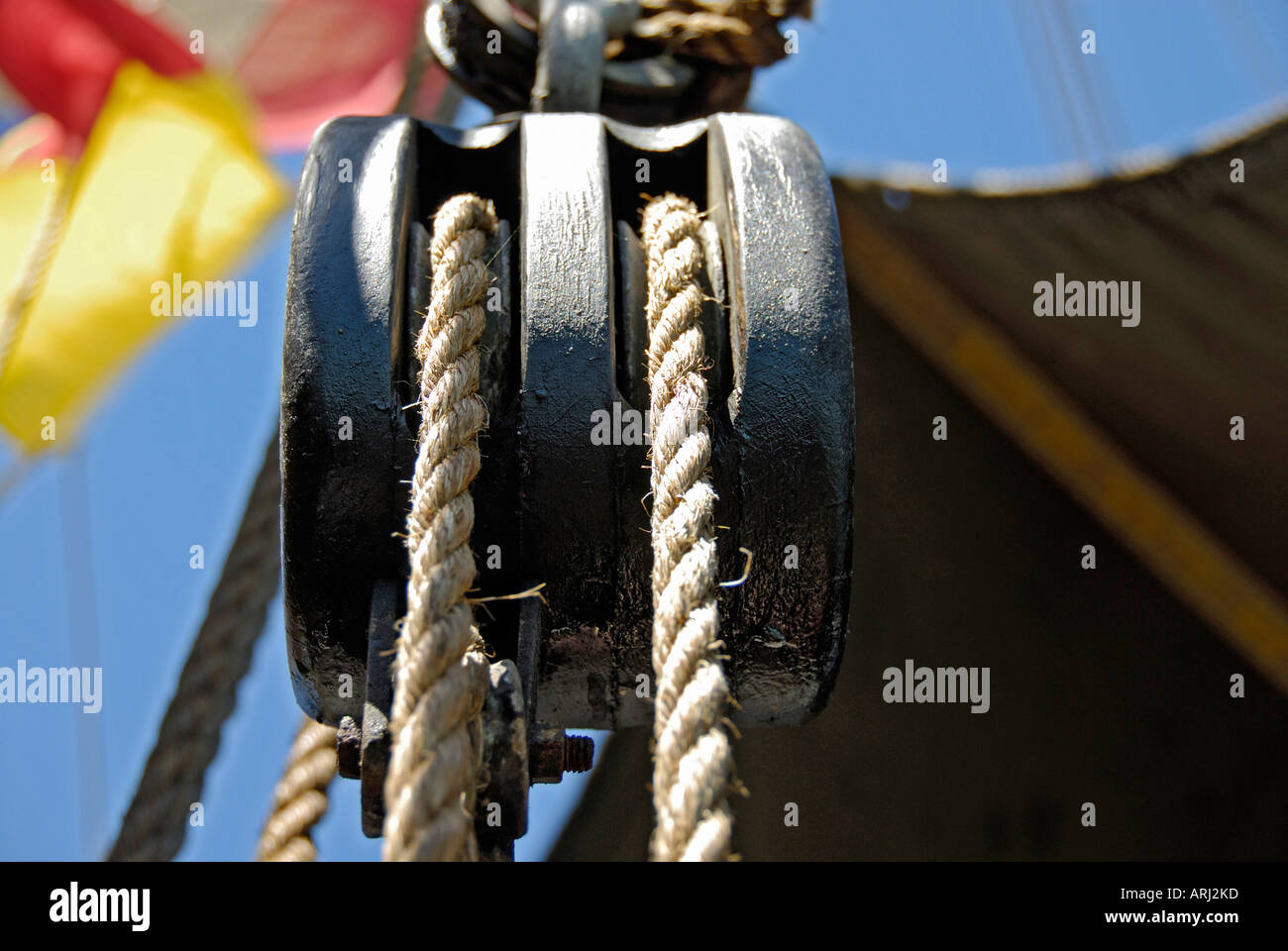 Ropes pulleys are extensively used on a large sailing boat Stock Photo