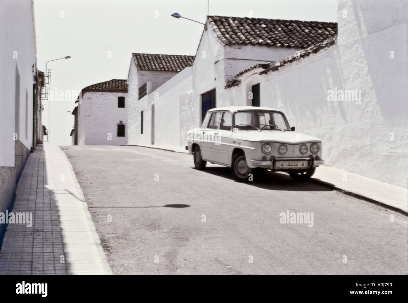 White car in a white town Stock Photo - Alamy