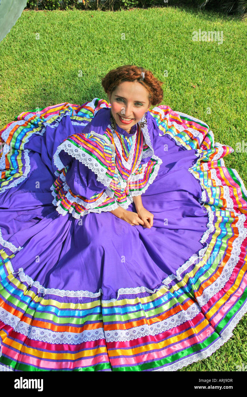 Pretty Mexican Woman In Traditional Cultural Dance Clothing Sitting In 