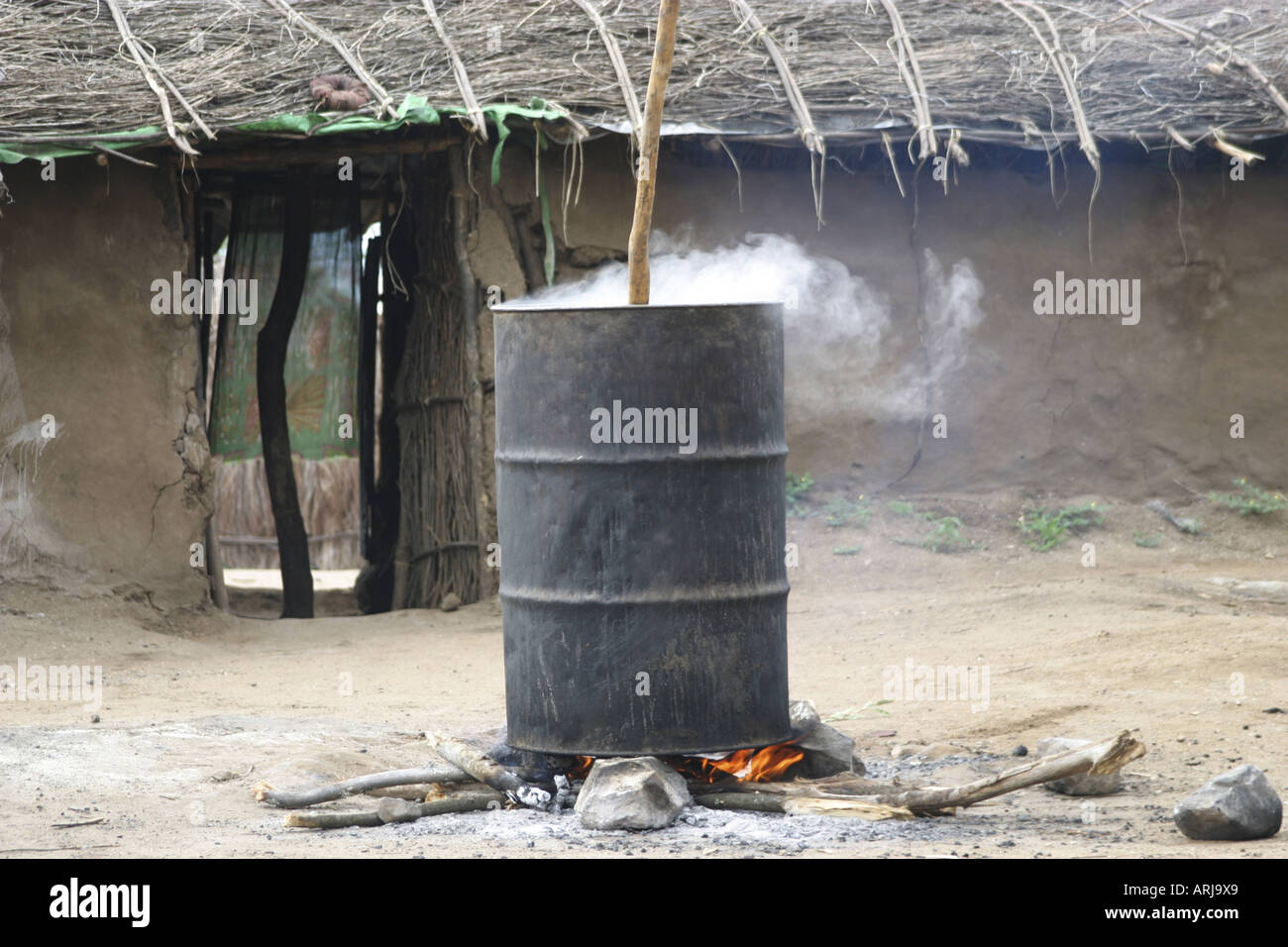 food is cooking in a barrel, Sudan Stock Photo