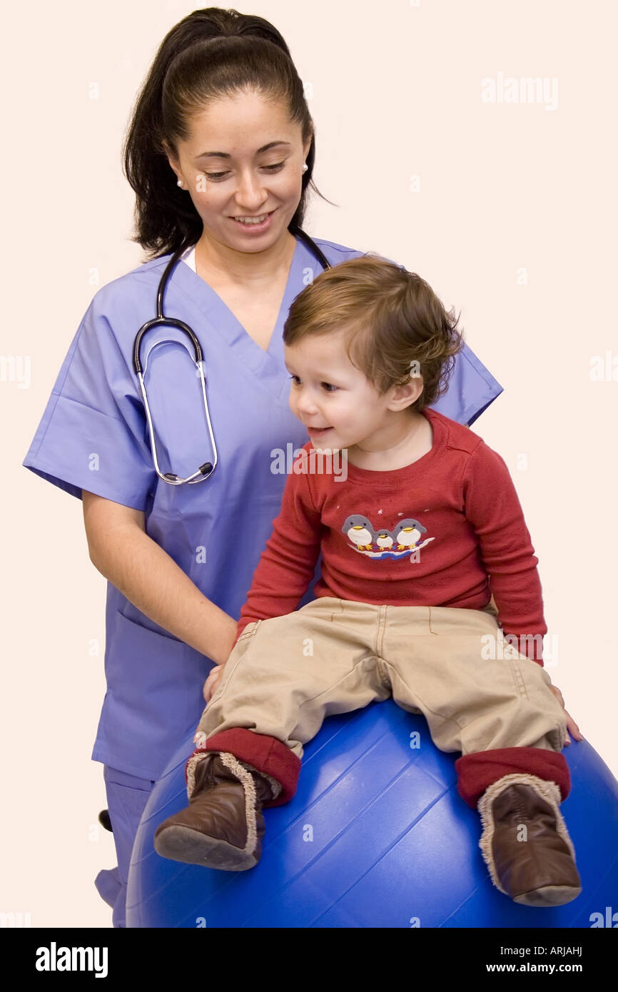 Pretty Hispanic nurse and young child isolated on white Stock Photo