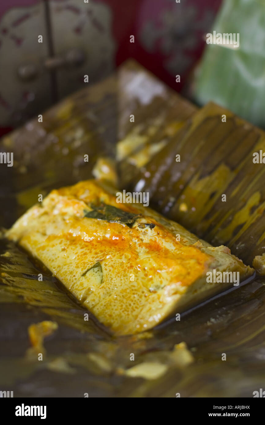 The Malaysian food speciality otak otak, pureed spiced fish wrapped in banana leaves Stock Photo