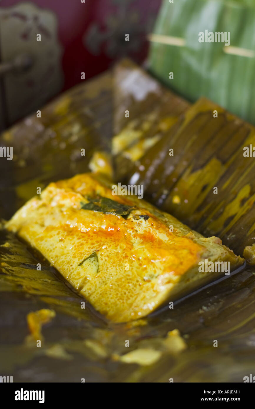The Malaysian food speciality otak otak, pureed spiced fish wrapped in banana leaves Stock Photo