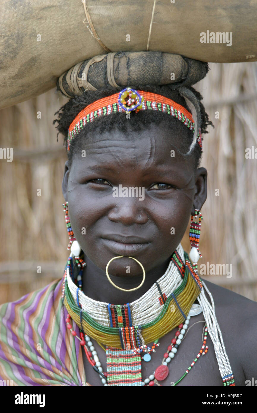 Toposa woman with burden on her head, portrait, Sudan Stock Photo