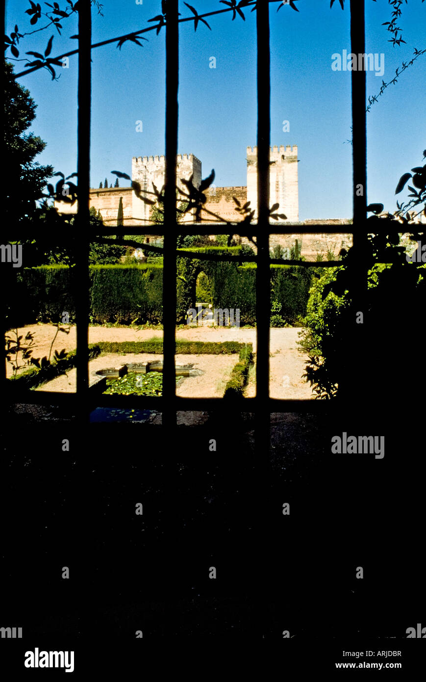 View of the Alhambra through a gate from the outside. Stock Photo