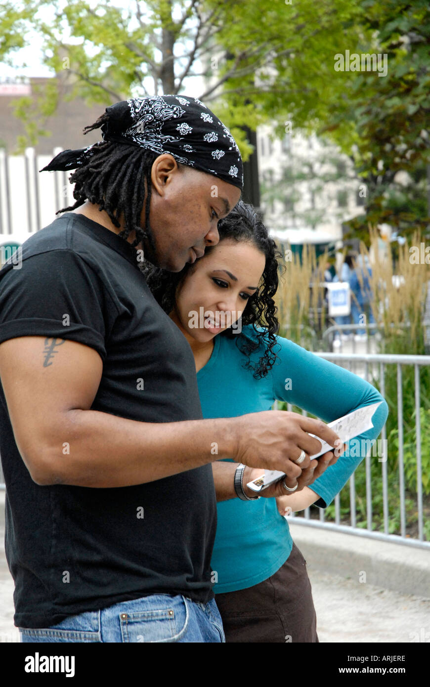 Husband and wife look over a map to determine directions in downtown