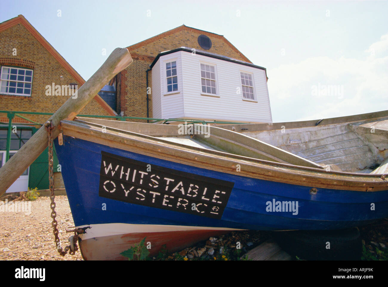 Fishing boat on the beach, Whitstable, Kent, England, UK. Whitstable is popular for it's oyster and fish restaurants. Stock Photo