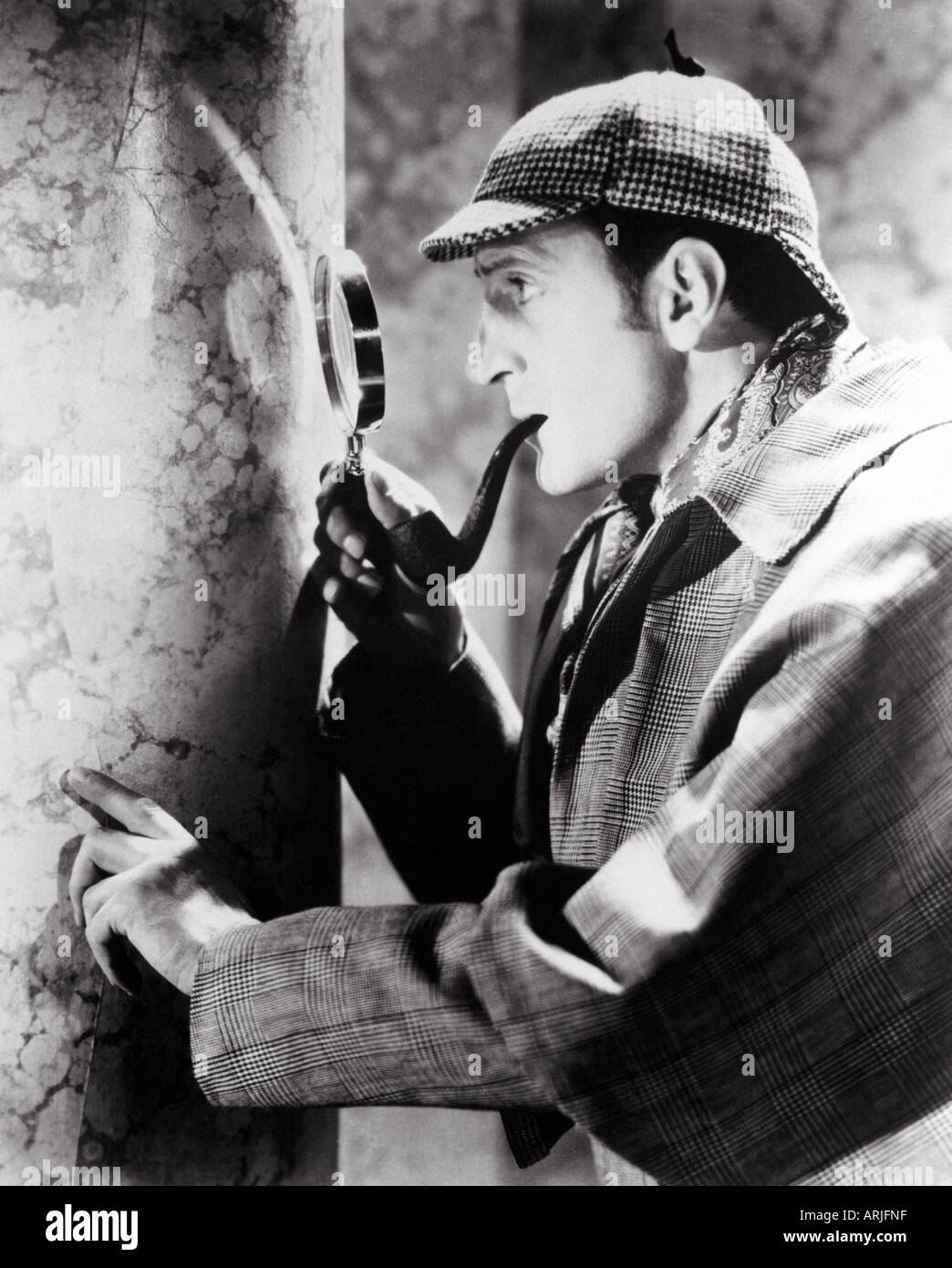BASIL RATHBONE in his classic film role as Sherlock Holmes Stock Photo