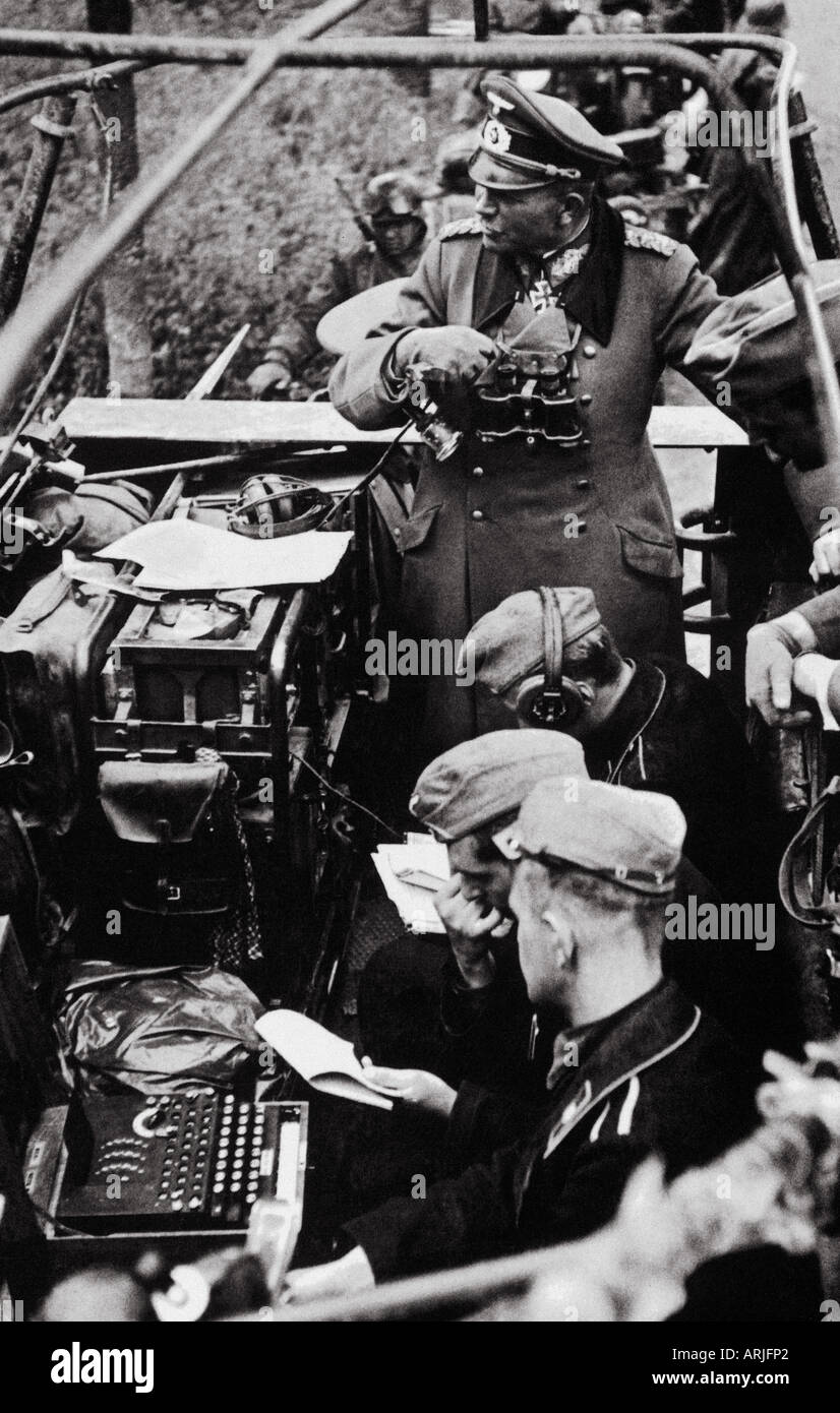 ENIGMA German Army Enigma encoding machine in use in 1944 as Field Marshall Guderian stands behind the radio operators Stock Photo