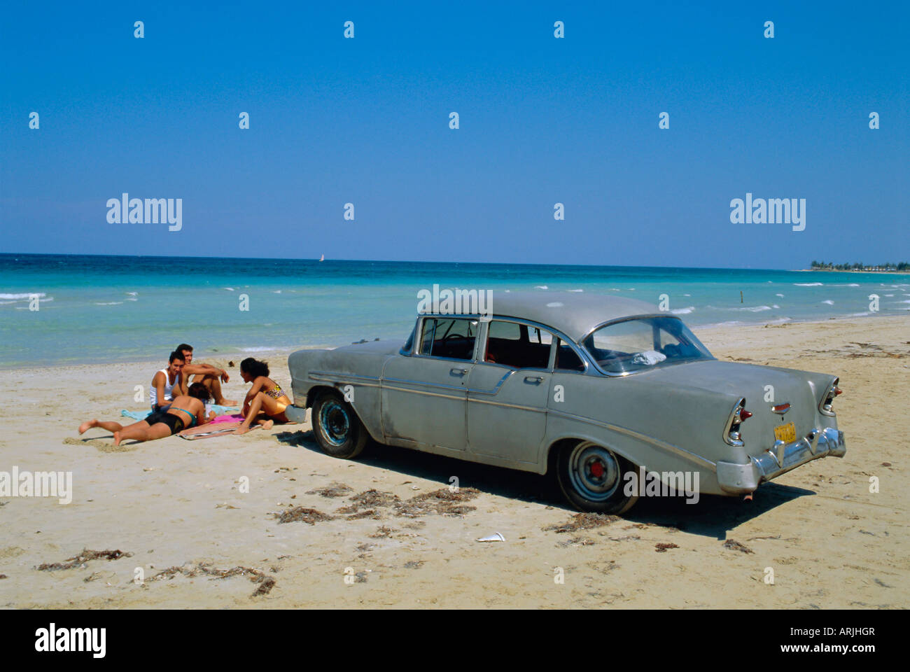 1950's American car on the beach, Goanabo, Cuba, Caribbean Sea, Central America Stock Photo