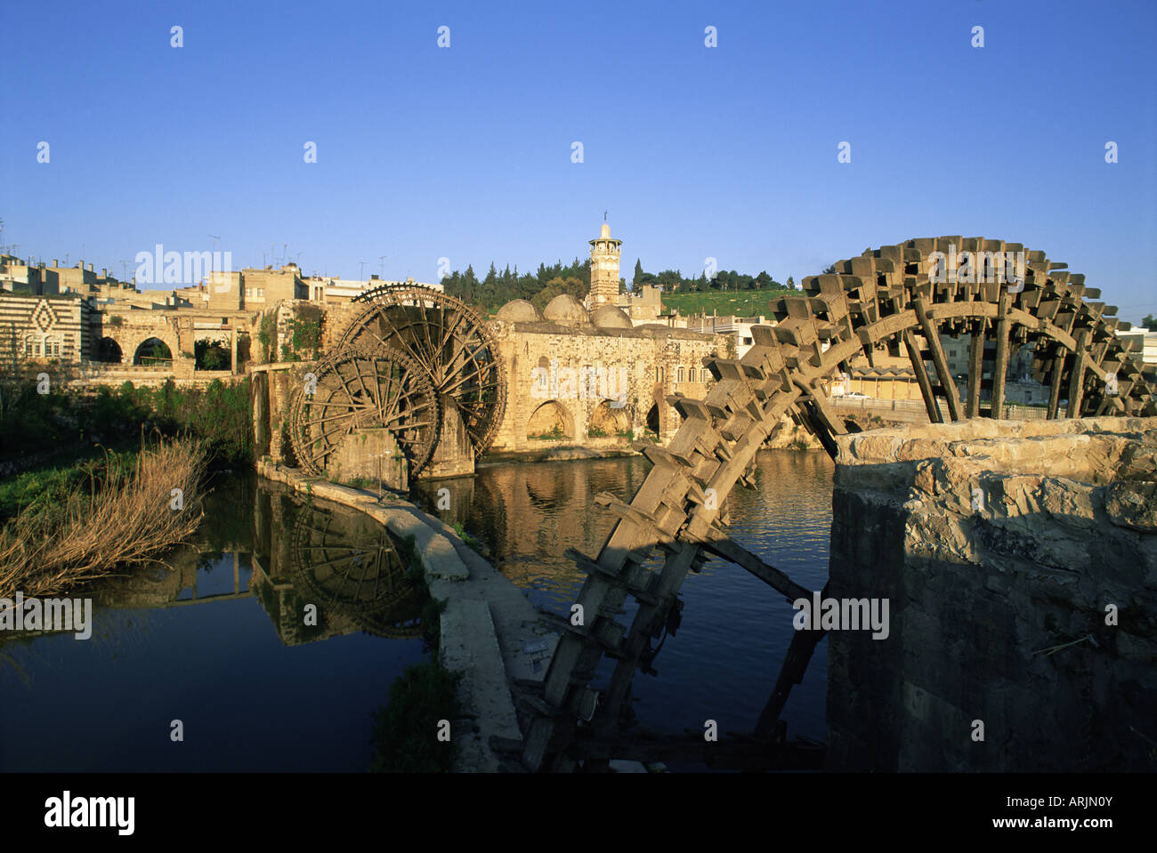 Al Jaabariys, norias (nourias) (water wheels), and the Al Nour Mosque, on the Orontes River, Hama, Syria, Middle East Stock Photo