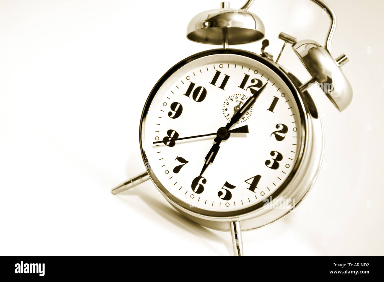 Ringing Alarm clock showing just after 6 am with fresh and modern toning Stock Photo